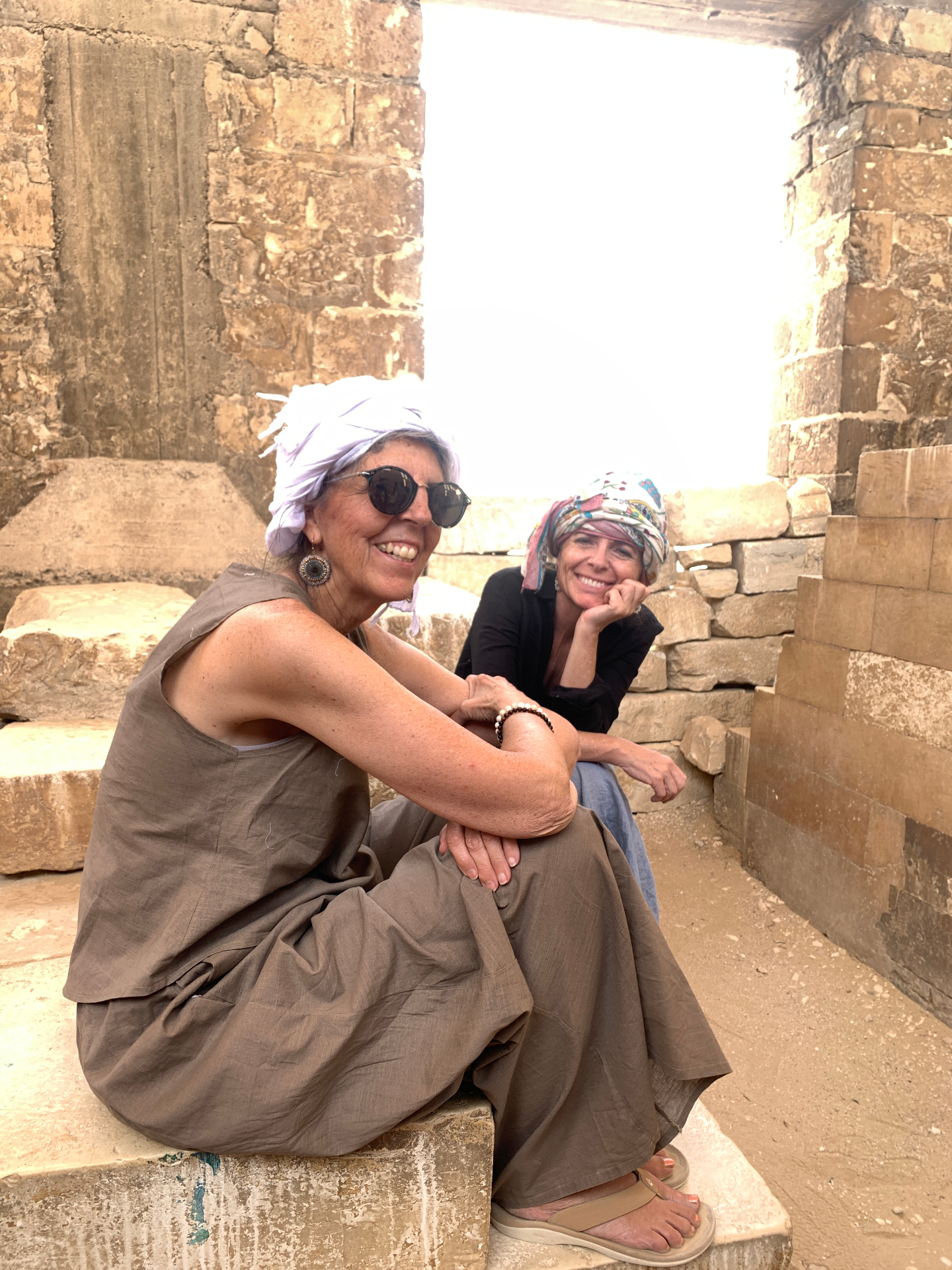 Friends sharing a moment among ancient stones